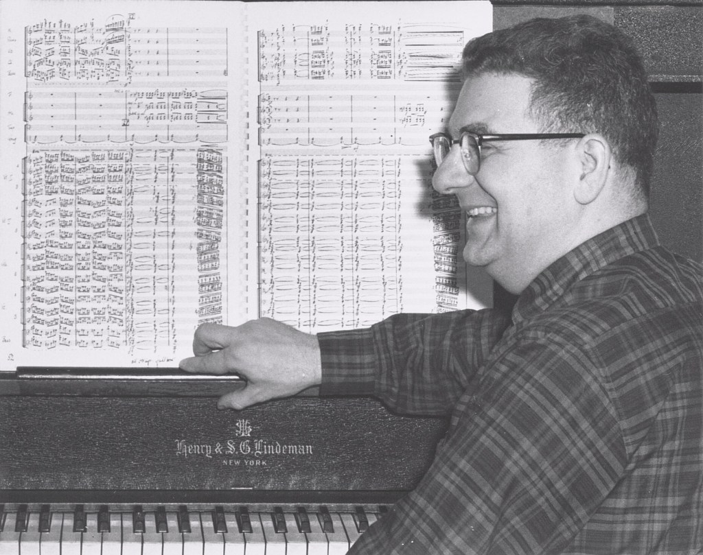 Frank Lewin sitting at a piano in the 1960s.